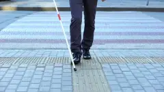 depositphotos_309297968-stock-photo-visually-impaired-man-using-tactile